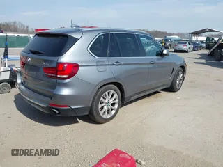 2015 BMW X5 xDrive35i with VIN 5UXKR0C53F0K60910, listed as a IAAI auction lot 41857733 with 153,583 mi miles. Bid and sale history available at carsss.com. Image 4.