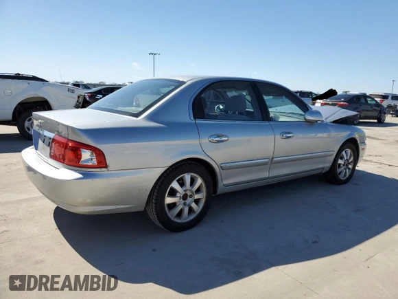 2005 Kia Optima LX z VIN KNAGD128055433689, wystawiony jako Copart lot #46909305 z przebiegiem 27 609 mil mil oraz Szkoda całkowita • Salvage title. Historia ofert i sprzedaży dostępna na DreamBid. Obrazek 3.