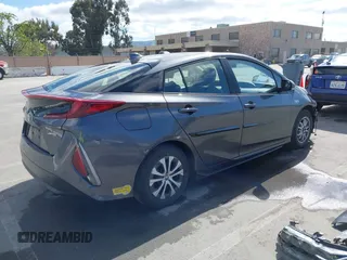 2022 Toyota Prius LE with VIN JTDKAMFP7N3206830, listed as a IAAI auction lot 41984239 with 57,681 mi miles and . Bid and sale history available at DreamBid. Image 4.