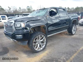 2017 GMC Sierra 1500 Denali with VIN 3GTU2PEJ2HG260736, listed as a IAAI auction lot 41724075 with 104,805 mi miles. Bid and sale history available at carsss.com. Image 2.