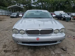 2007 Jaguar XJ with VIN SAJWA71B17SH14626, listed as a Copart auction lot 71013573 with 156,134 mi miles and Salvage Title. Bid and sale history available at carsss.com. Image 5.