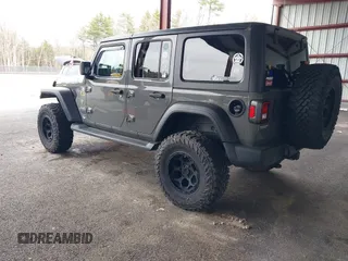 2021 Jeep Wrangler Unlimited Sport S z VIN 1C4HJXDG2MW542087, wystawiony jako IAAI lot #41893734 z przebiegiem 57 000 mil mil oraz . Historia ofert i sprzedaży dostępna na DreamBid. Obrazek 3.