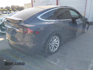 2018 Tesla Model X 75D with VIN 5YJXCDE28JF142509, listed as a IAAI auction lot 41993444 with 100,244 mi miles and . Bid and sale history available at carsss.com. Image 4.