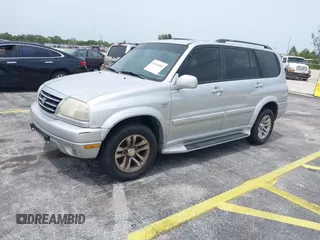 2003 Suzuki XL7 Touring z VIN JS3TX92V434114930, wystawiony jako IAAI lot #42414005 z przebiegiem 148 945 mil mil oraz . Historia ofert i sprzedaży dostępna na DreamBid. Obrazek 2.