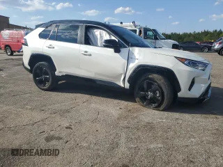 2021 Toyota RAV4 Hybrid XSE with VIN 2T3E6RFV1MW028094, listed as a Copart auction lot 52596615 with 68,497 mi miles and Salvage title. Bid and sale history available at DreamBid. Image 4.