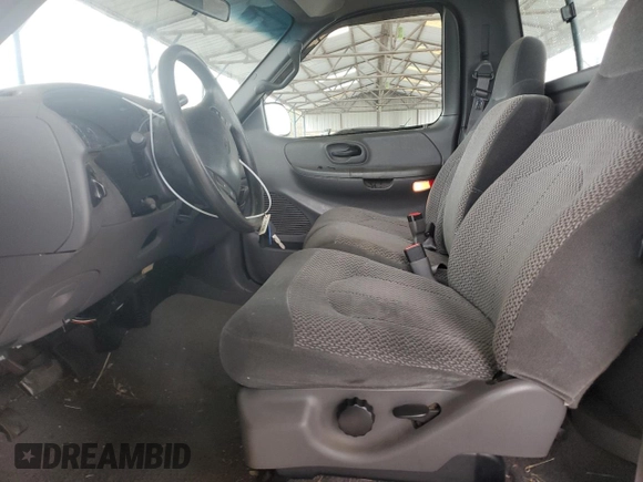 1999 Ford F-150 XL with VIN 2FTRF17L0XCB19827, listed as a Copart auction lot 85282164 with 52,103 mi miles and Salvage title. Bid and sale history available at DreamBid. Image 7.