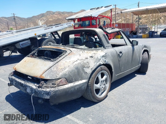 1988 Porsche 911 z VIN WP0EB0917JS161351, wystawiony jako IAAI lot #39908257 z przebiegiem Nie podano mil oraz . Historia ofert i sprzedaży dostępna na DreamBid. Obrazek 4.