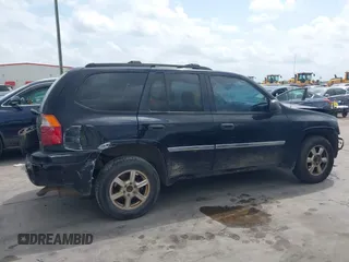 2009 GMC Envoy SLE z VIN 1GKDS33S592105035, wystawiony jako IAAI lot #42089058 z przebiegiem 249 127 mil mil oraz . Historia ofert i sprzedaży dostępna na DreamBid. Obrazek 14.