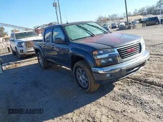2012 GMC Canyon SLE2 with VIN 1GTH6PFE3C8146637, listed as a IAAI auction lot 40604818 with 1 mi miles. Bid and sale history available at carsss.com. Image 1.