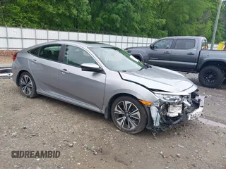 2017 Honda Civic EX-L z VIN 19XFC1F77HE026030, wystawiony jako IAAI lot #42112898 z przebiegiem 73 793 mil mil oraz . Historia ofert i sprzedaży dostępna na DreamBid. Obrazek 1.