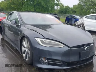 2020 Tesla Model S Long Range with VIN 5YJSA1E21LF413251, listed as a IAAI auction lot 42350131 with 16,427 mi miles and . Bid and sale history available at DreamBid. Image 1.
