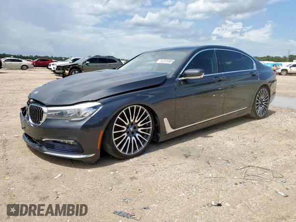 2016 BMW 7 Series 740i with VIN WBA7E2C57GG714564, listed as a Copart auction lot 64005965 with 111,598 mi miles and Salvage title. Bid and sale history available at DreamBid. Image 1.