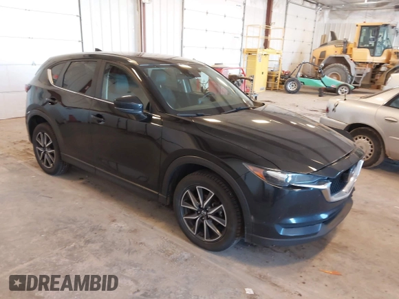 2018 Mazda CX-5 Touring with VIN JM3KFBCM9J0437490, listed as a IAAI auction lot 42006998 with 176,959 mi miles. Bid and sale history available at carsss.com. Image 1.