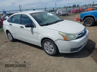 2011 Ford Focus S with VIN 1FAHP3EN7BW113051, listed as a IAAI auction lot 42002223 with 220,895 mi miles. Bid and sale history available at carsss.com. Image 1.