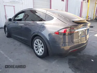 2018 Tesla Model X 75D with VIN 5YJXCDE28JF142509, listed as a IAAI auction lot 41993444 with 100,244 mi miles and . Bid and sale history available at carsss.com. Image 3.