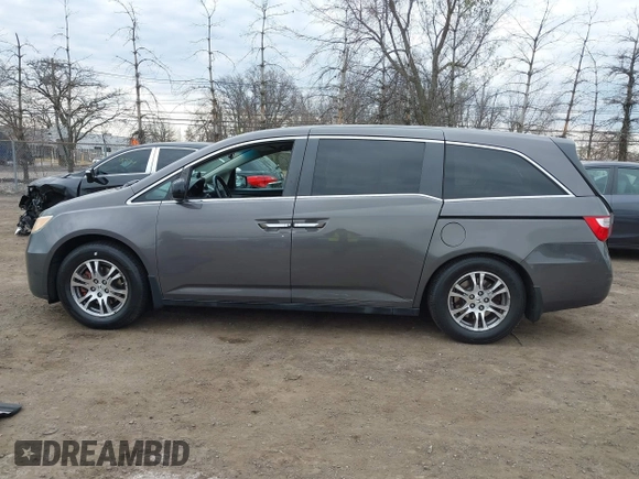 2012 Honda Odyssey EX-L with VIN 5FNRL5H65CB042898, listed as a IAAI auction lot 41784075 with 179,596 mi miles and . Bid and sale history available at carsss.com. Image 14.