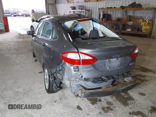2014 Ford Fiesta SE with VIN 3FADP4BJ9EM117175, listed as a IAAI auction lot 41737432 with 156,141 mi miles. Bid and sale history available at carsss.com. Image 3.