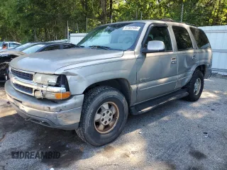 2000 Chevrolet Tahoe LS with VIN 1GNEK13T2YJ203710, listed as a Copart auction lot 57302495 with 237,227 mi miles and Salvage title. Bid and sale history available at DreamBid. Image 1.