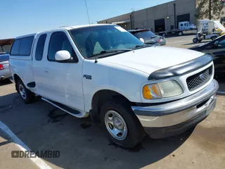 1998 Ford F-150 XL with VIN 1FTZX072XWKA12003, listed as a IAAI auction lot 41765328 with 119,445 mi miles and . Bid and sale history available at DreamBid. Image 1.
