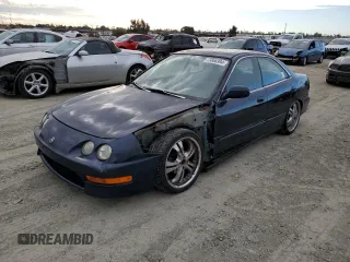 1998 Acura Integra LS with VIN JH4DB7653WS002571, listed as a Copart auction lot 73806394 with 258,143 mi miles and Salvage title. Bid and sale history available at DreamBid. Image 1.