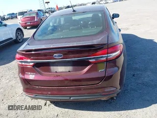 2017 Ford Fusion SE z VIN 3FA6P0H70HR198507, wystawiony jako IAAI lot #42033338 z przebiegiem 94 363 mil mil oraz . Historia ofert i sprzedaży dostępna na DreamBid. Obrazek 16.