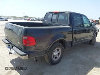 2003 Ford F-150 XLT with VIN 1FTRW07L53KC01651, listed as a IAAI auction lot 41827007 with 233,842 mi miles and . Bid and sale history available at DreamBid. Image 4.