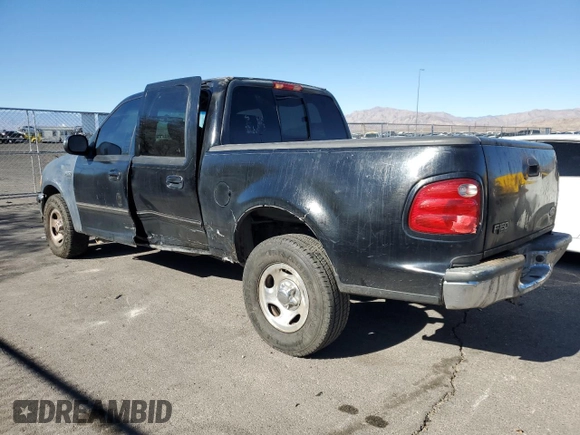 2002 Ford F-150 XLT with VIN 1FTRW07682KB94008, listed as a Copart auction lot 88724185 with 231,464 mi miles and Salvage Title. Bid and sale history available at carsss.com. Image 2.