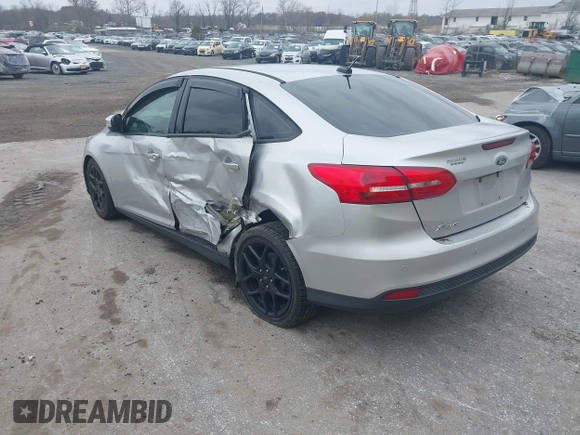 2015 Ford Focus SE with VIN 1FADP3F29FL258781, listed as a IAAI auction lot 41963223 with 121,286 mi miles and . Bid and sale history available at DreamBid. Image 3.