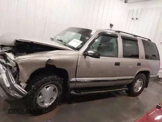 1999 GMC Yukon with VIN 1GKEK13R7XJ723255, listed as a IAAI auction lot 41879617 with 148,324 mi miles. Bid and sale history available at carsss.com. Image 14.