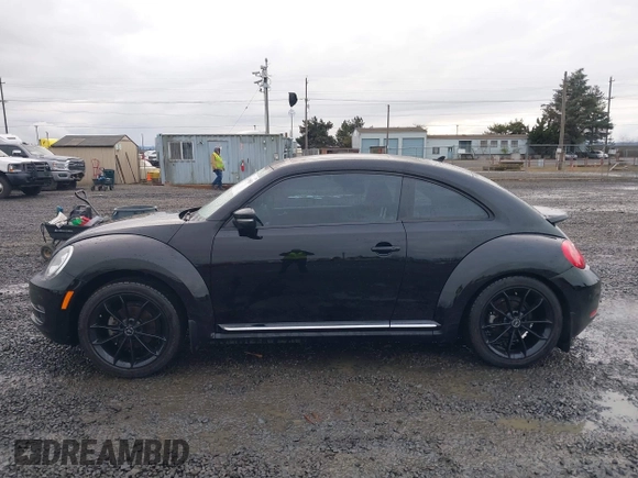 2014 Volkswagen Beetle 2.5L w/Sun with VIN 3VWJP7AT3EM608906, listed as a IAAI auction lot 41501830 with 42,804 mi miles and . Bid and sale history available at DreamBid. Image 14.