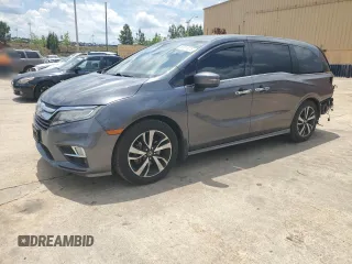 2018 Honda Odyssey Elite with VIN 5FNRL6H96JB015464, listed as a Copart auction lot 56911075 with 120,868 mi miles and Clean title. Bid and sale history available at DreamBid. Image 1.