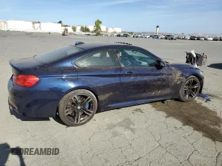 2015 BMW M4 with VIN WBS3R9C50FK335084, listed as a Copart auction lot 61962965 with 142,157 mi miles and Salvage title. Bid and sale history available at DreamBid. Image 3.