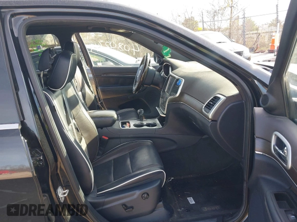 2014 Jeep Grand Cherokee Overland with VIN 1C4RJECG4EC523747, listed as a IAAI auction lot 40802143 with 124,079 mi miles. Bid and sale history available at carsss.com. Image 5.