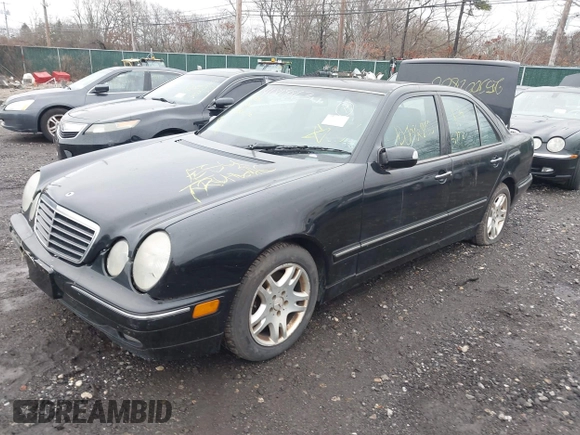 2002 Mercedes-Benz E-Class with VIN WDBJF82J52X064244, listed as a IAAI auction lot 41819863 with 999,999 mi miles. Bid and sale history available at carsss.com. Image 2.