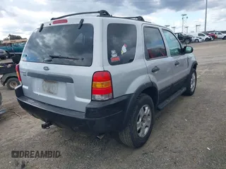 2002 Ford Escape XLT Choice with VIN 1FMYU04152KA39941, listed as a IAAI auction lot 41753639 with 209,016 mi miles. Bid and sale history available at carsss.com. Image 4.