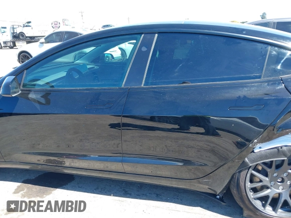 2025 Tesla Model 3 Long Range with VIN 5YJ3E1EA5SF919681, listed as a IAAI auction lot 41818042 with 2,173 mi miles and . Bid and sale history available at DreamBid. Image 15.