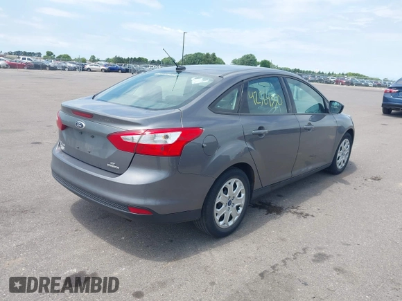 2012 Ford Focus SE z VIN 1FAHP3F21CL463413, wystawiony jako IAAI lot #42564350 z przebiegiem 115 849 mil mil oraz . Historia ofert i sprzedaży dostępna na DreamBid. Obrazek 4.
