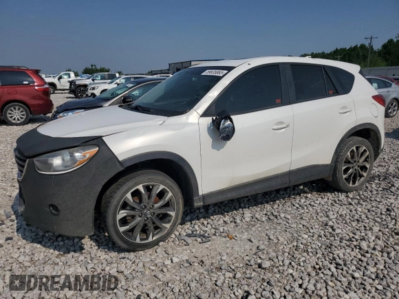 2016 Mazda CX-5 Grand Touring z VIN JM3KE4DY7G0864109, wystawiony jako Copart lot #59635865 z przebiegiem Nie podano mil oraz Czysty tytuł • Clean title. Historia ofert i sprzedaży dostępna na DreamBid. Obrazek 1.