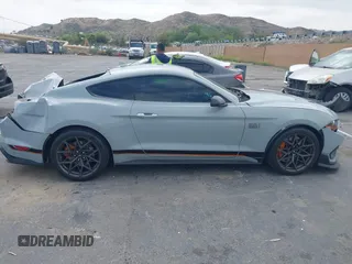 2022 Ford Mustang Mach 1 with VIN 1FA6P8R08N5552580, listed as a IAAI auction lot 42140418 with 14,383 mi miles and . Bid and sale history available at DreamBid. Image 13.