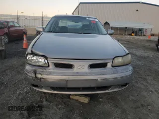 1999 Oldsmobile Cutlass GL z VIN 1G3NB52M8X6318016, wystawiony jako Copart lot #88782475 z przebiegiem Nie podano mil oraz Szkoda całkowita • Salvage title. Historia ofert i sprzedaży dostępna na DreamBid. Obrazek 5.