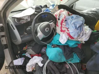 2015 Smart fortwo Passion с VIN WMEEJ9AA1FK831357, выставлен на аукционе Copart как лот 87001564 с пробегом Не указан миль и Списание • Salvage title. История ставок и продаж доступна на DreamBid. Изображение 8.