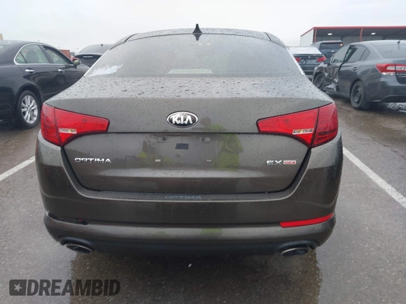 2013 Kia Optima EX z VIN 5XXGN4A79DG181719, wystawiony jako IAAI lot #42372478 z przebiegiem 166 410 mil mil oraz . Historia ofert i sprzedaży dostępna na DreamBid. Obrazek 16.