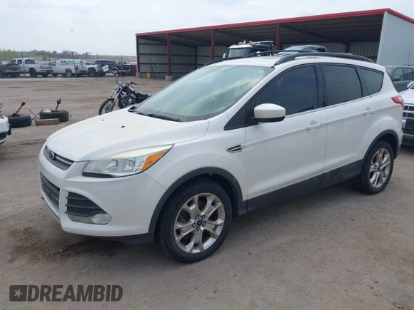 2014 Ford Escape SE with VIN 1FMCU9GX9EUB15944, listed as a IAAI auction lot 42110269 with 120,297 mi miles and . Bid and sale history available at DreamBid. Image 2.