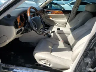 2002 Jaguar XJ with VIN SAJDA15BX2MF47193, listed as a Copart auction lot 49065275 with 69,544 mi miles and Salvage title. Bid and sale history available at DreamBid. Image 7.