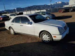1999 Mercedes-Benz E-Class with VIN WDBJF82H1XX024280, listed as a Copart auction lot 83213204 with 212,712 mi miles and Salvage Title. Bid and sale history available at carsss.com. Image 4.