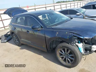 2020 Mazda CX-9 Touring with VIN JM3TCACY1L0419630, listed as a IAAI auction lot 42282675 with 105,207 mi miles and . Bid and sale history available at DreamBid. Image 1.