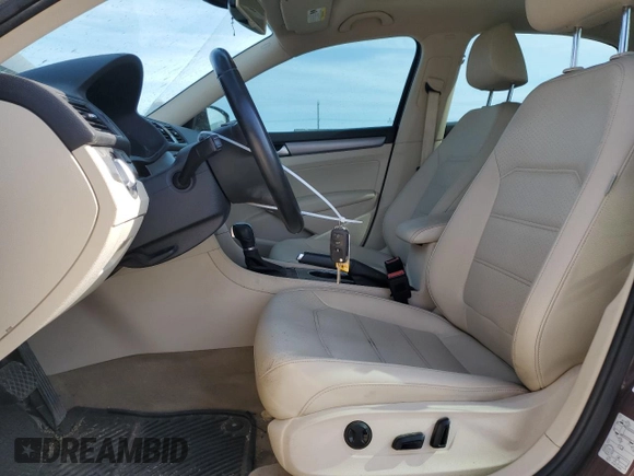 2014 Volkswagen Passat SE with VIN 1VWBN7A32EC088774, listed as a Copart auction lot 60753755 with 124,660 mi miles and Salvage title. Bid and sale history available at DreamBid. Image 7.