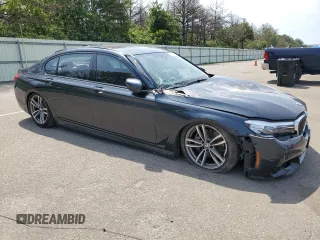 2019 BMW 7 Series 740i xDrive z VIN WBA7E4C56KGV71028, wystawiony jako Copart lot #76860474 z przebiegiem 66 657 mil mil oraz Nie do naprawy • Non repairable. Historia ofert i sprzedaży dostępna na DreamBid. Obrazek 4.