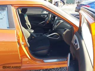 2015 Hyundai Veloster with VIN KMHTC6AD2FU225073, listed as a IAAI auction lot 41571336 with 128,819 mi miles. Bid and sale history available at carsss.com. Image 5.
