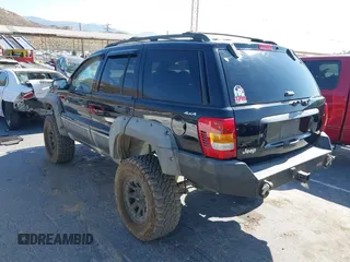 2000 Jeep Grand Cherokee Laredo with VIN 1J4GW48N0YC204645, listed as a IAAI auction lot 42650659 with 217,851 mi miles and . Bid and sale history available at DreamBid. Image 3.